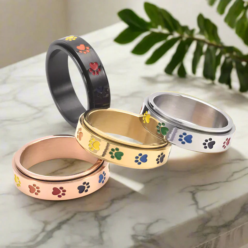 Bague Anti-Stress Rotative en Or et Argent avec Motifs de Pattes Colorées – Thea